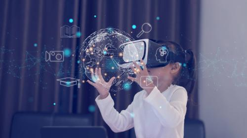 A young girl views the world through a virtual reality headset. (Photo credit: Shutterstock / Thanadon88)