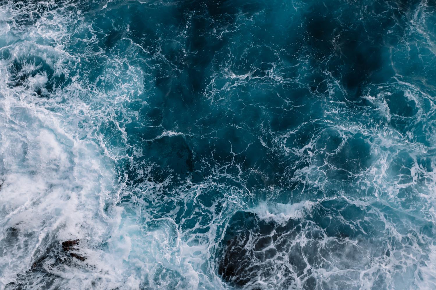 Aerial view to ocean waves.