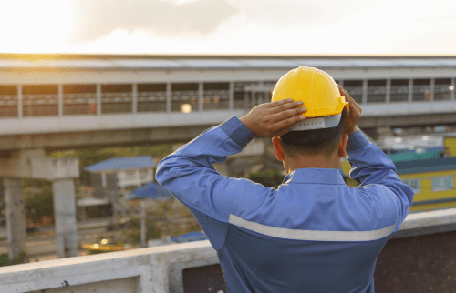 An immigrant worker wearing a hard hat